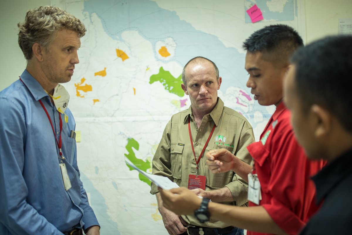 Robert Webb (center) at the Fire Control Center during fire threats briefing